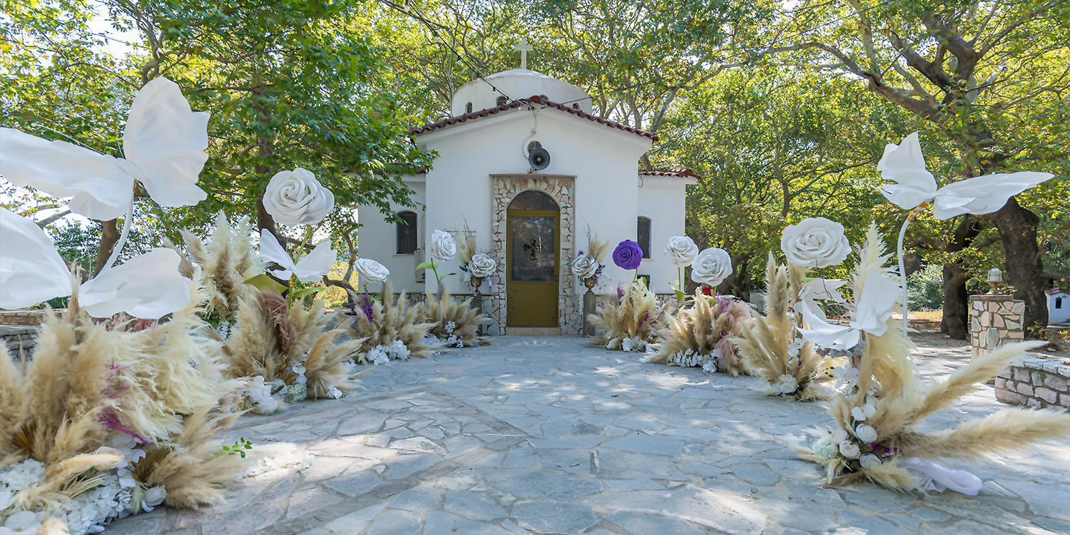 Whimsical Forest Christening with Oversized Floral Decor 15 Dreamy baptism aisle with oversized flowers and natural scenery by Rogdaki Events