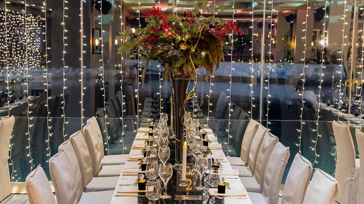 Moorings – Εταιρικό Χριστουγεννιάτικο Event /Astir Marina 7 Rogdaki Events Moorings interior corporate dinner panoramic view table setup lights astir marina