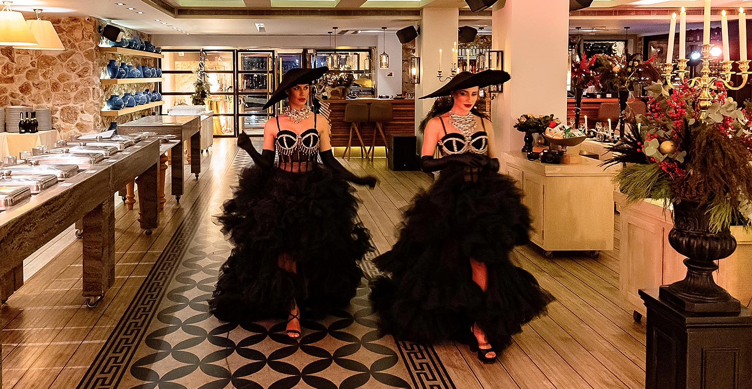 Moorings – Εταιρικό Χριστουγεννιάτικο Event /Astir Marina 12 Rogdaki Events Moorings interior performance entry extravagant costumes hats candles vouliagmeni