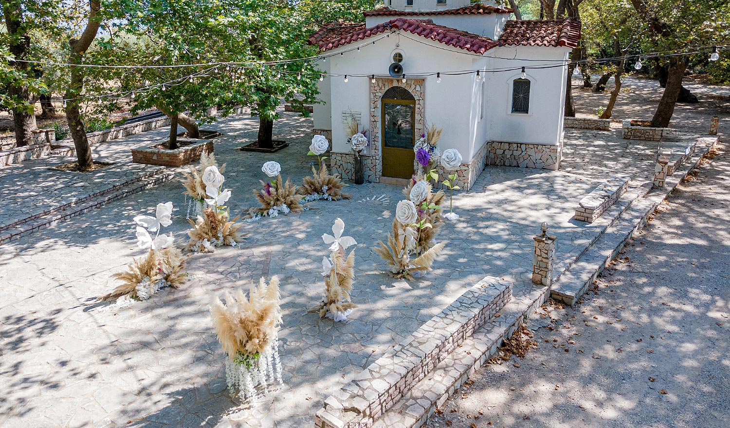 Whimsical Forest Christening with Oversized Floral Decor 4 Whimsical forest baptism setup featuring giant paper flowers, curated by Rogdaki Events.