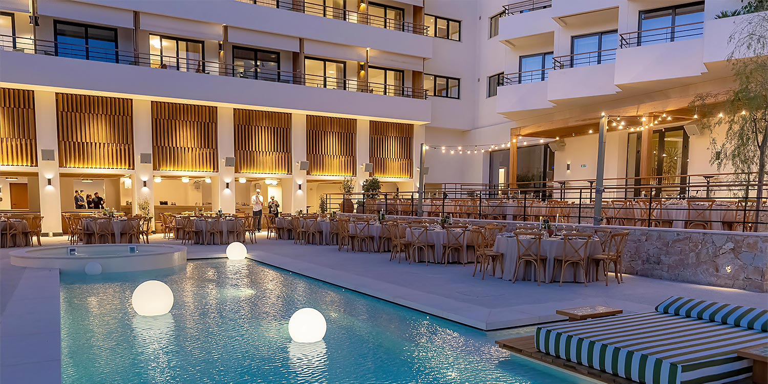 Corporate dinner composition by Rogdaki Events Design against the architecture of Ace Hotel Athens.