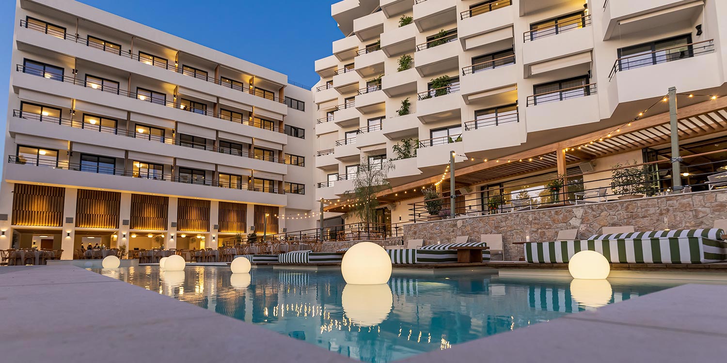 Evening corporate event styling by Rogdaki Events Design featuring glowing spheres in the Ace Hotel pool.
