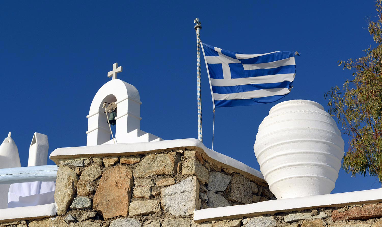 Mykonos | Japanese-Romanian Destination Wedding 4 Greek flag hosting elegant Japanese Romanian wedding celebrations by Rogdaki Events, Aegean romance