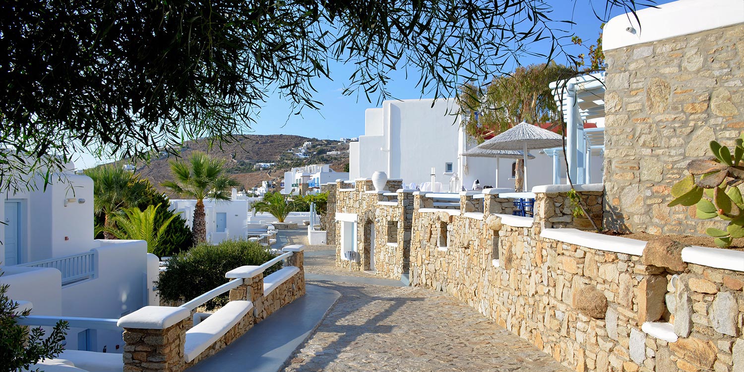 Mykonos | Japanese-Romanian Destination Wedding 1 Picturesque whitewashed paths, stone walls & sunny Cycladic charm at Saint John Hotel in Mykonos