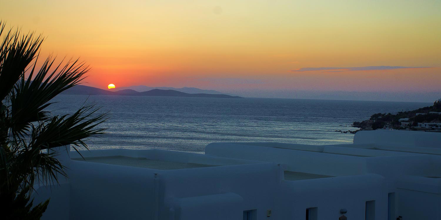 Mykonos | Japanese-Romanian Destination Wedding 27 Stunning sunset views over the Aegean Sea at a Japanese Romanian wedding in Mykonos' Saint John, by Rogdaki Events
